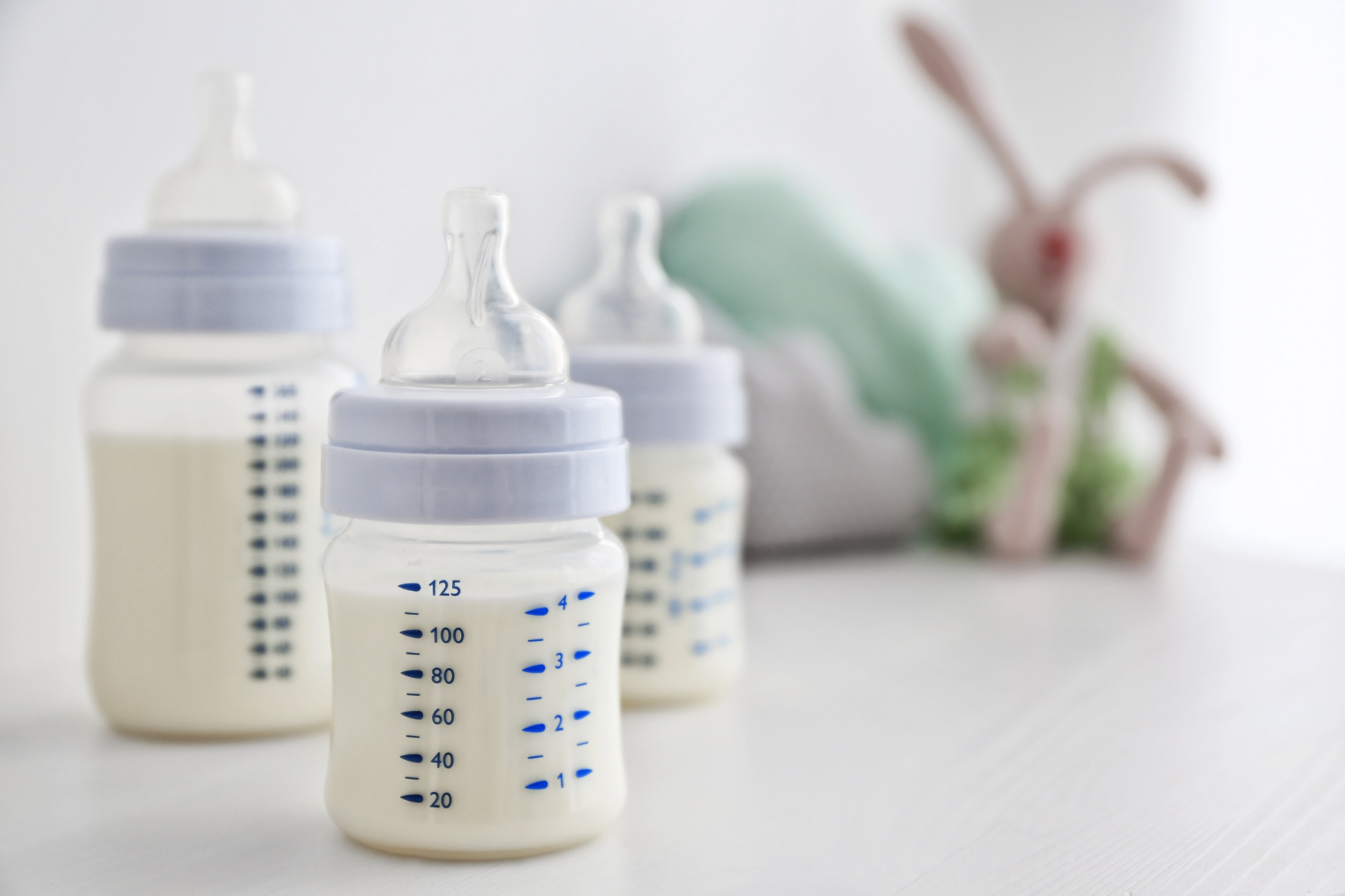Mom breastfeeding her baby, management of overproduction of breast milk.